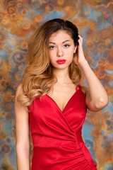 Young beautiful blonde woman in red dress