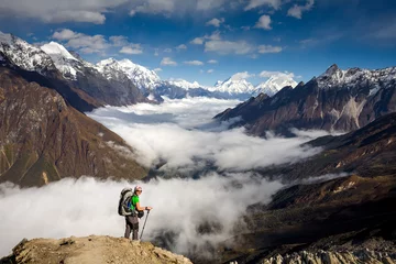 Rideaux velours Manaslu Trekker on the way to the valley covered with cloud on Manaslu circuit trek in Nepal