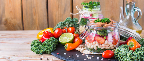 Obraz na płótnie Canvas Healthy vegan salad in a mason jar with beans