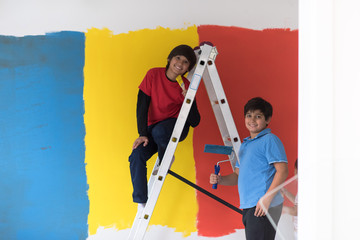 boys painting wall