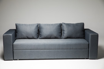 Grey sofa isolated on grey background