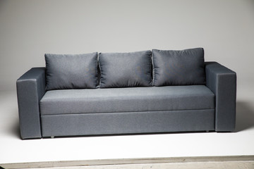 Grey sofa isolated on grey background