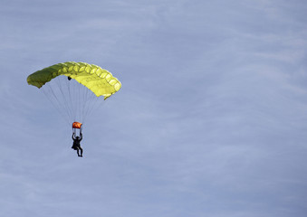 Man in a yellow parachute