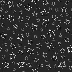 Stars seamless pattern. White hand drawn stars on black background