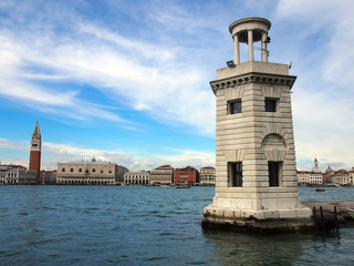 lighthouse in san giorgio venice with panoramic view of venetian coastline clouds and sea