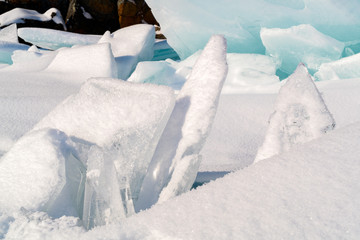 Fototapeta na wymiar Ice blocks cover with snow at Lake Baikal