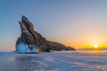 Fototapeta na wymiar View of Ogoy Island in Frozen Lake Baikal at sunrise