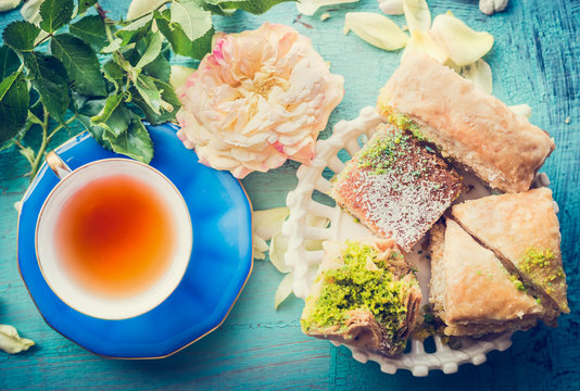 Afternoon Tea Time With Cup Of Tea And  Homemade Phyllo Pastry Cakes, Top View