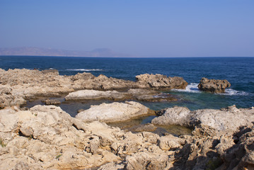 Fototapeta na wymiar Rocky beach on the Mediterranean sea in Greece