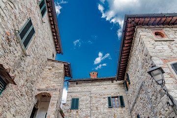 the Chianti countryside in Tuscany with vineyards and villas and farmhouses in the hills