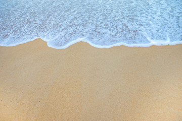 Fototapeta na wymiar Soft Wave Of Ocean On Sandy Beach. Background. Selective