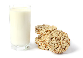 Glass of fresh milk with biscuit isolated on white background