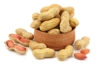 peanuts in wood plate isolated on the white background
