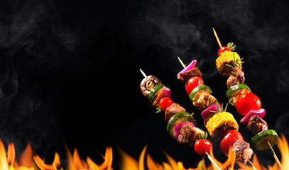 Collage of grilled meat skewers and vegetables