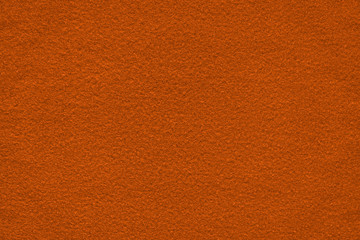 Dark orange (bronze) felt surface close up