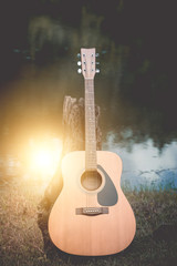 Obraz premium acoustic guitar background on riverside.