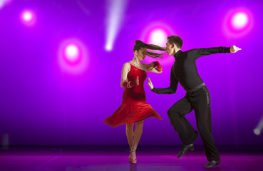 Couple ballroom dancing on illumination