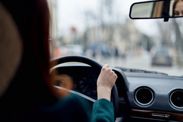 Fototapeta na wymiar woman in car, steering wheel, driver