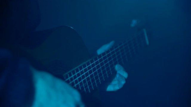 Man playing guitar close-up
