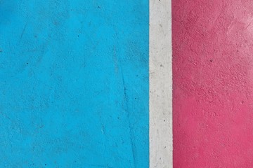 White line on colorful concrete floor of outdoor basketball court.