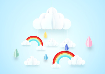 Paper art concept. Rainy and cloud with rainbow on soft blue background
