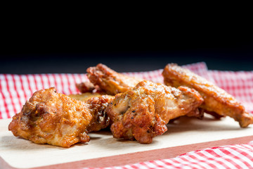 delicious fried chicken wings on table
