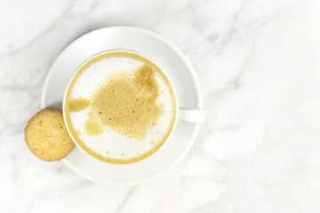 Cup of coffee with milk and butter cookie