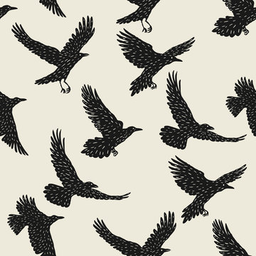Seamless pattern with black flying ravens. Hand drawn inky birds © incomible