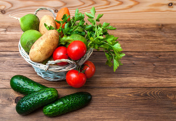 Mix of fresh vegetables on a wooden table. The concept of a healthy diet