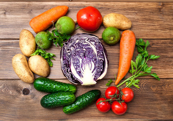 Mix of fresh vegetables on a wooden table. The concept of a healthy diet