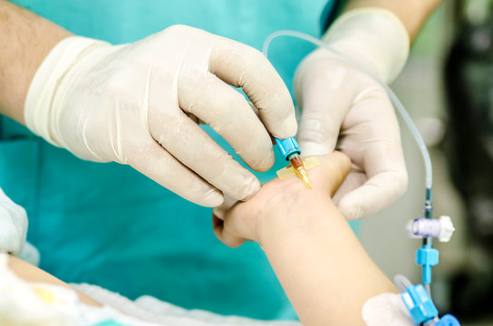 Setting up a peripheral catheter to monitor invasive blood pressure.