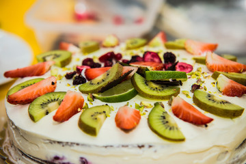 Fresh fruit tart in sunlight.