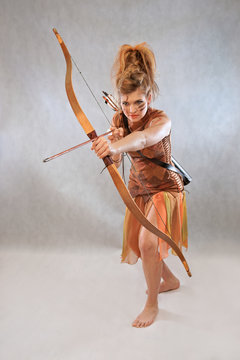 Woman in orange and brown outfit, warrior, fashion, studio