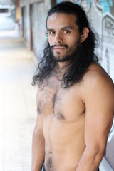 Shirtless evil looking man portrait