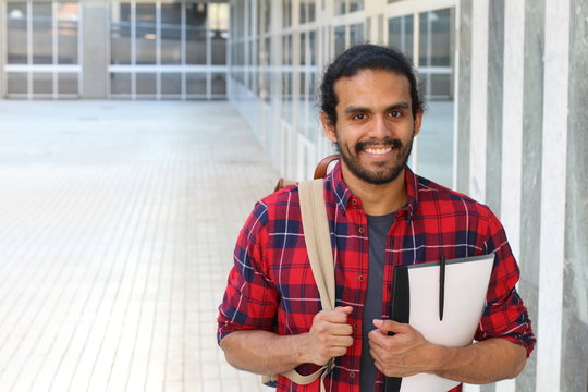 Cute mixed race student smiling isolated with copy space