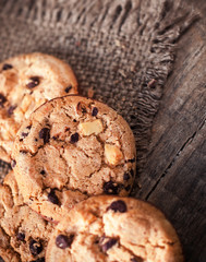 Chocolate chip cookies on dark old wooden table with place for text.,  freshly baked. Selective Focus with Copy space.