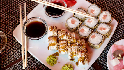 Rainbow Sushi Roll with salmon, eel, tuna, avocado, royal prawn, cream cheese Philadelphia, caviar tobica, chuka. Sushi menu. Japanese food.