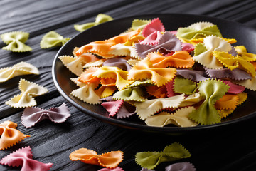 Italian raw multicolored farfalle pasta close-up. horizontal