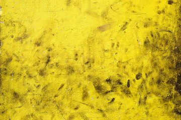 Yellow and black damaged plaster background. Structures and textures. Bangalore, India.  