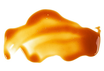Sweet caramel sauce isolated on a white background, top view