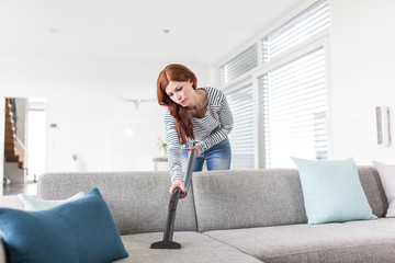 Cleaning the Sofa with Vacuum Cleaner