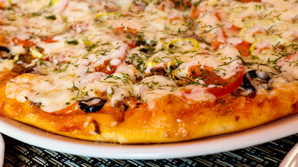 Part of delicious Italian pizza on a plate