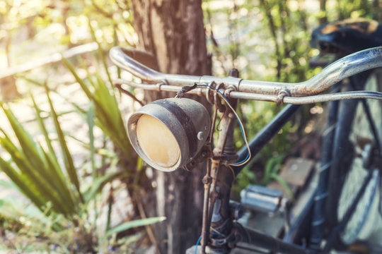 old vintage bicycle and light in garden