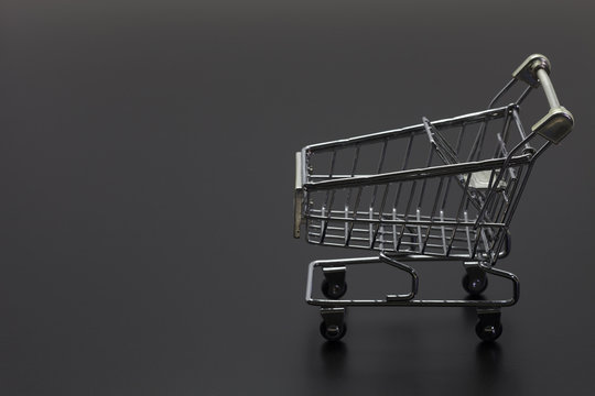 Shopping Cart On Black Background.