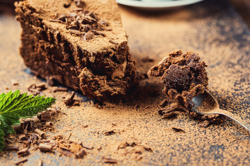 chocolate cake with Candies,Chocolate cake with a cut piece and blade on gray background, closeup,Dark chocolate cake,Delicious vegan chocolate cake,Tasty chocolate cake on wooden background