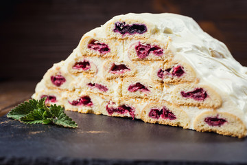 Cake with cream and cherries and cup of coffee,tasty cake with white cream,Russian cake named 