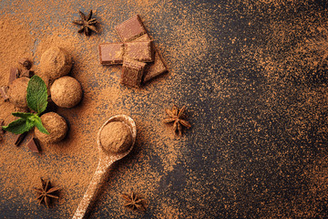 Chocolate truffle,Truffle chocolate candies with cocoa powder.Homemade fresh energy balls with chocolate.Gourmet assorted truffles made by chocolatier.Chunks of chocolate and coffee beans,copy space
