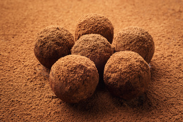 Chocolate truffle,Truffle chocolate candies with cocoa powder.Homemade fresh energy balls with chocolate.Gourmet assorted truffles made by chocolatier.Chunks of chocolate and coffee beans