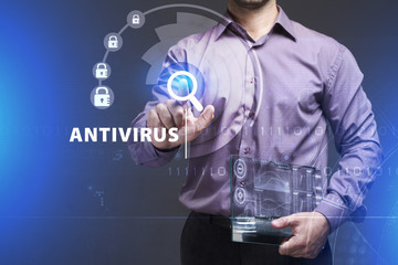 Business, Technology, Internet and network concept. Young businessman working on a virtual screen of the future and sees the inscription: Antivirus