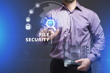 Business, Technology, Internet and network concept. Young businessman working on a virtual screen of the future and sees the inscription: File security